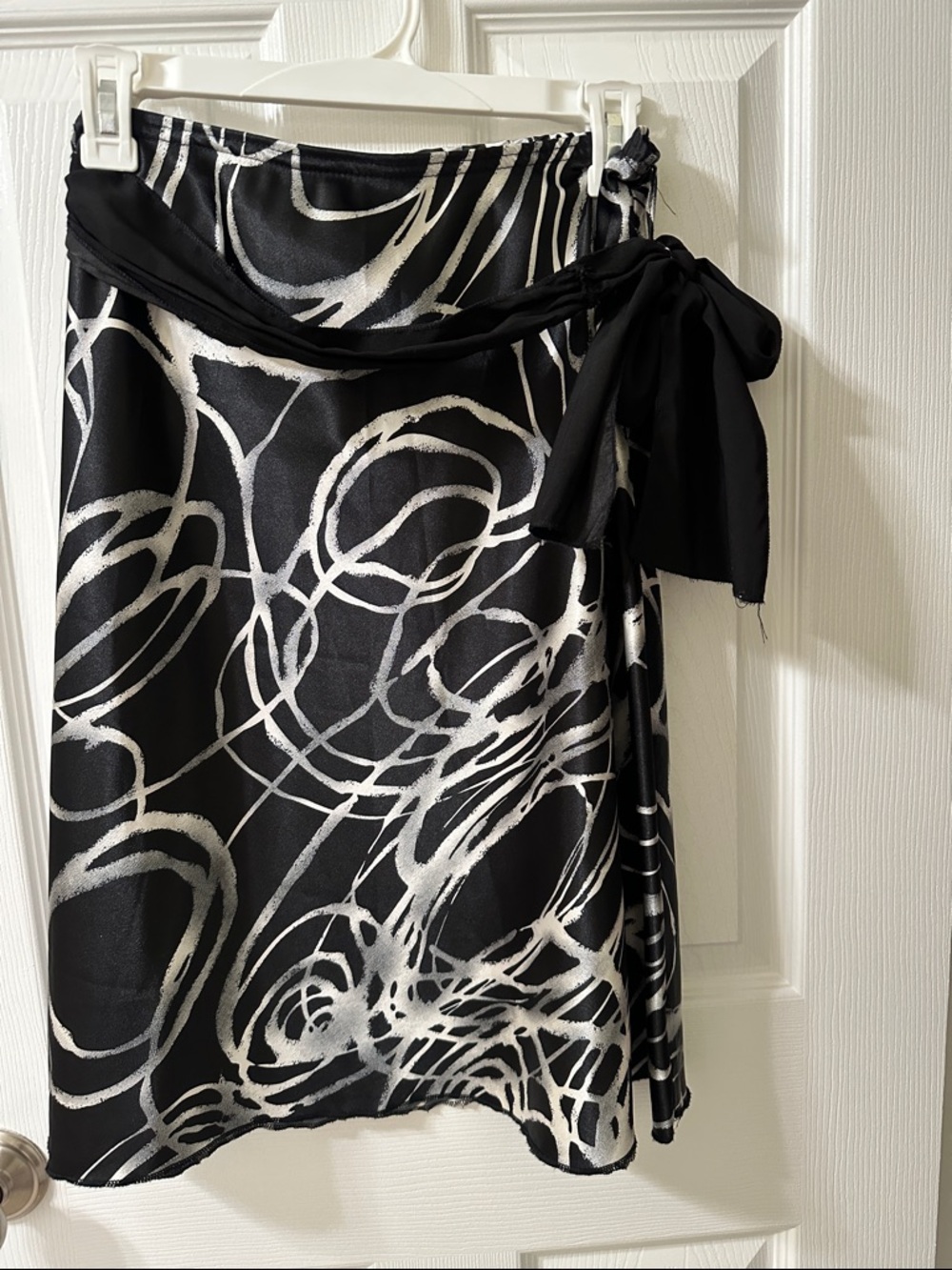 Wrapper Black and White Abstract Wrap Skirt with Pink Logo
